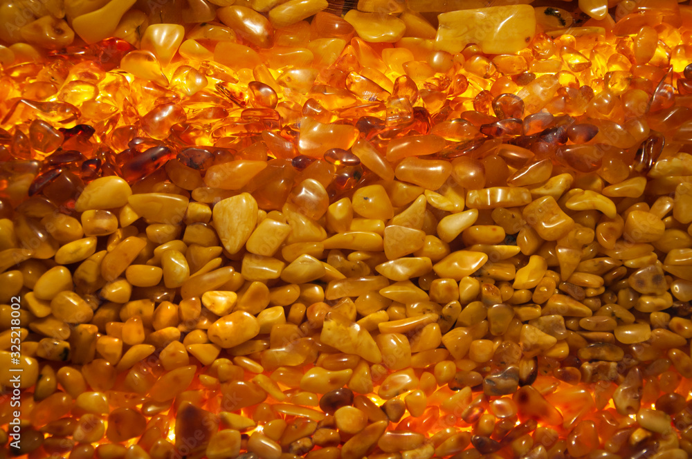 Many beautiful amber stones as a texture or background. Amber Wall Many beautiful amber stones as a texture or background. Amber Wall