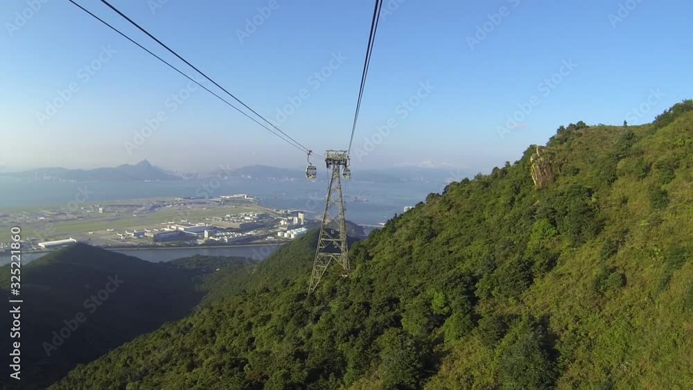 Cable Car way above mountains. Aerial view. Travel destinations. Road to Buddha statue. POV Cable Car way above mountains. Aerial view. Travel destinations. Road to Buddha statue. POV