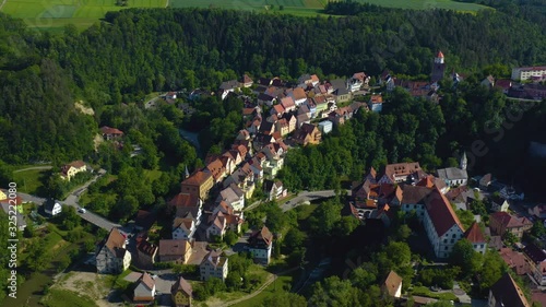 Aerial view of the village and castle Haigerloch in Germany. Wide view with pan to the right from the back. photo