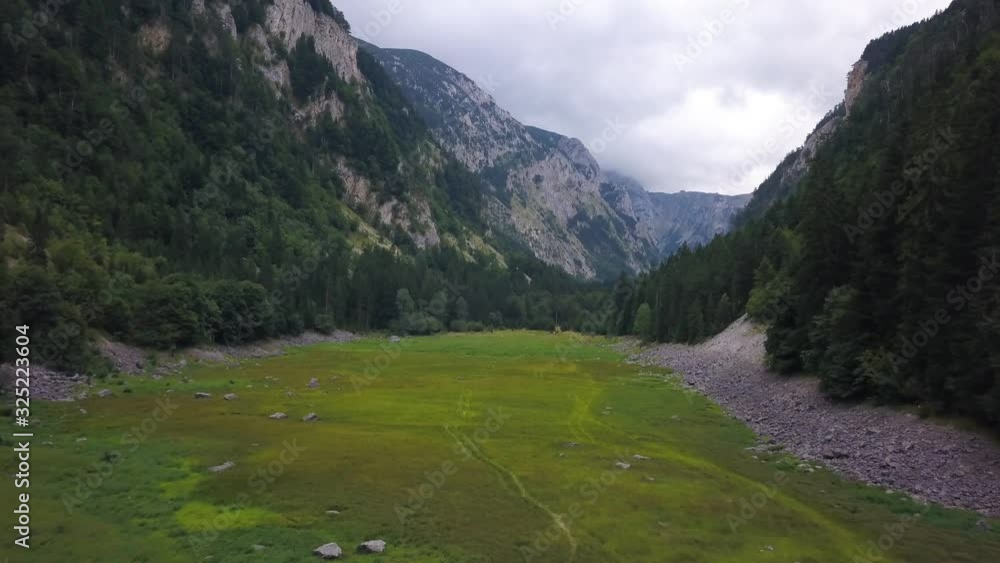The Dry Bed of Glacier Lake. Susicko Lake Valley. Drained Mountain Valley Glacial Lake. Isuseno Susicko Jezero The Dry Bed of Glacier Lake. Susicko Lake Valley. Drained Mountain Valley Glacial Lake. Isuseno Susicko Jezero