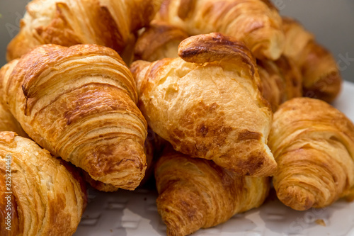 fresh croissants on a plate