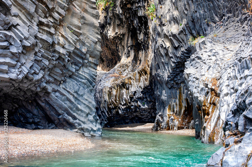 Alcantara river with basalt geological formations. Gole Alcantara Botanical and Geological Park in Sicily near to Etna volcano in Italy
