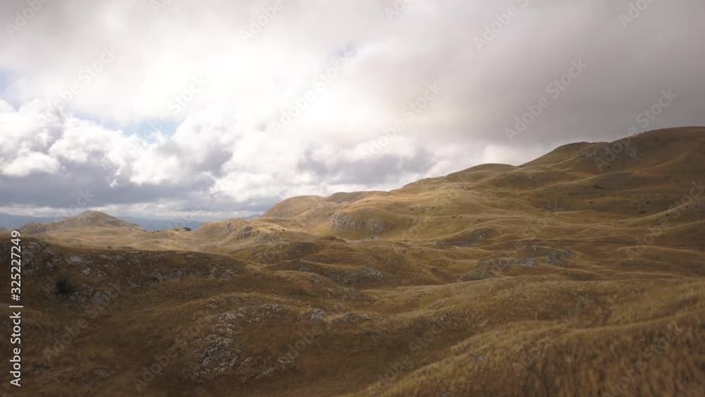 Durmitor Mountain Range. A Winding Path Through the Durmitor Ring. Mountain Landscape. Vast Meadows. Durmitorski Prsten Durmitor Mountain Range. A Winding Path Through the Durmitor Ring. Mountain Landscape. Vast Meadows. Durmitorski Prsten
