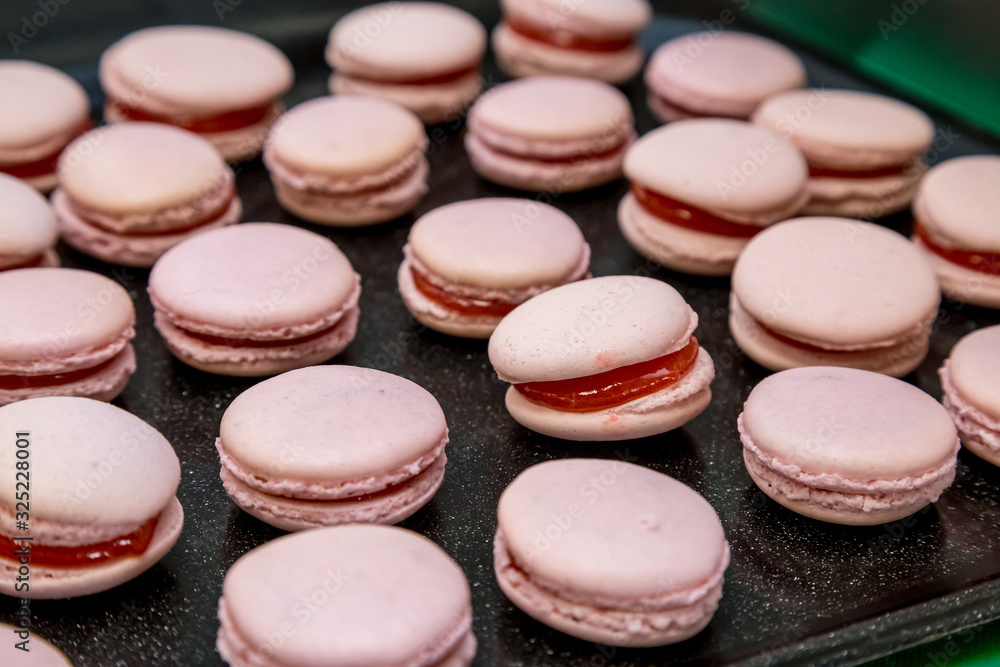 colorful macaroons on a wooden table colorful macaroons on a wooden table