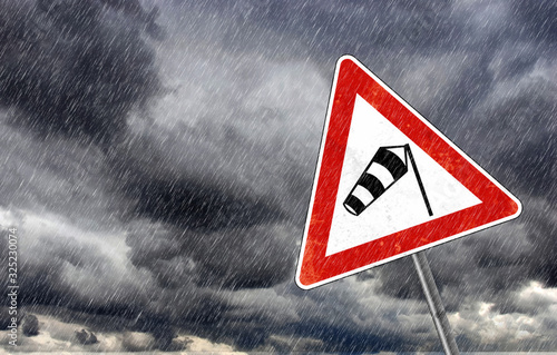 Bad Weather warning sign- Caution - Risk of Storm and Heavy Rain, photo