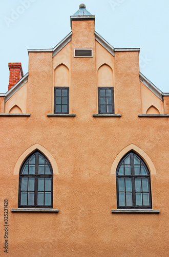 exterior facade of old orange building in visby sweden