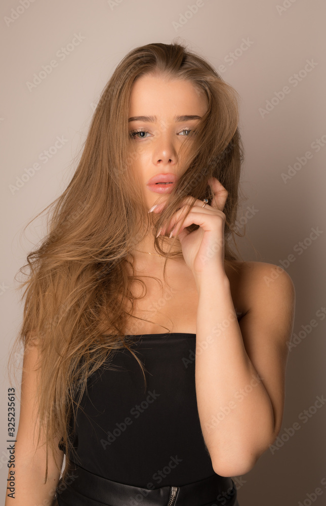 Young beautiful girl studio portrait. Young beautiful girl studio portrait.