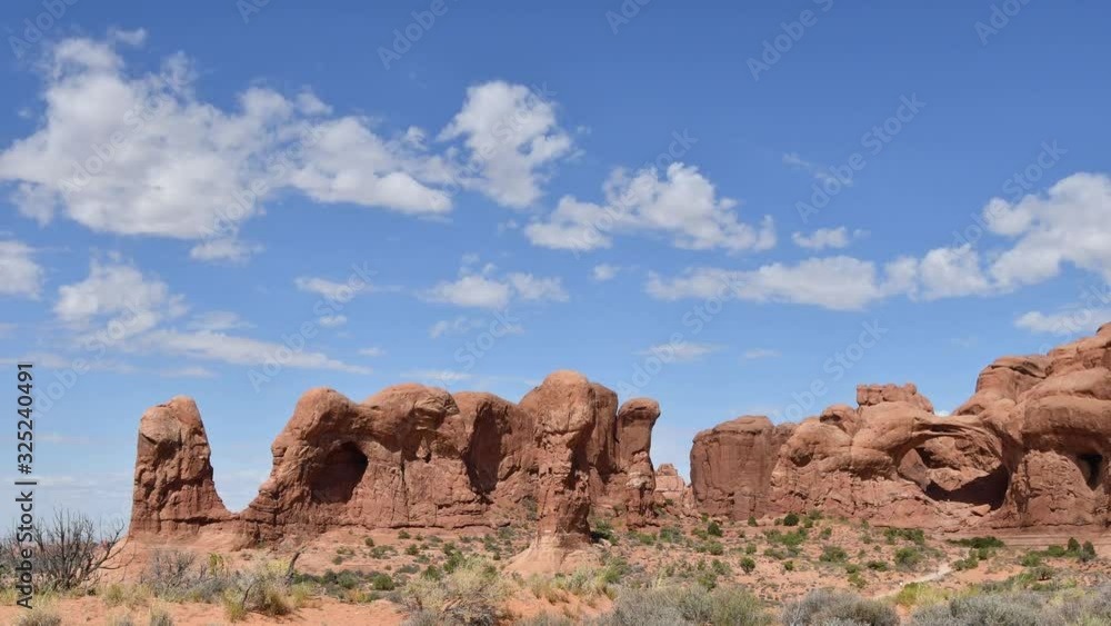 Panning timelapse at Arches national Park, Moab, Utah. Camera panning left to right. Clouds moving left to right. Panning timelapse at Arches national Park, Moab, Utah. Camera panning left to right. Clouds moving left to right.