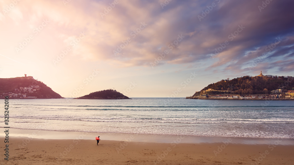 Sunset on La Concha beach in San Sebastian in the Basque Country. Sunset on La Concha beach in San Sebastian in the Basque Country.