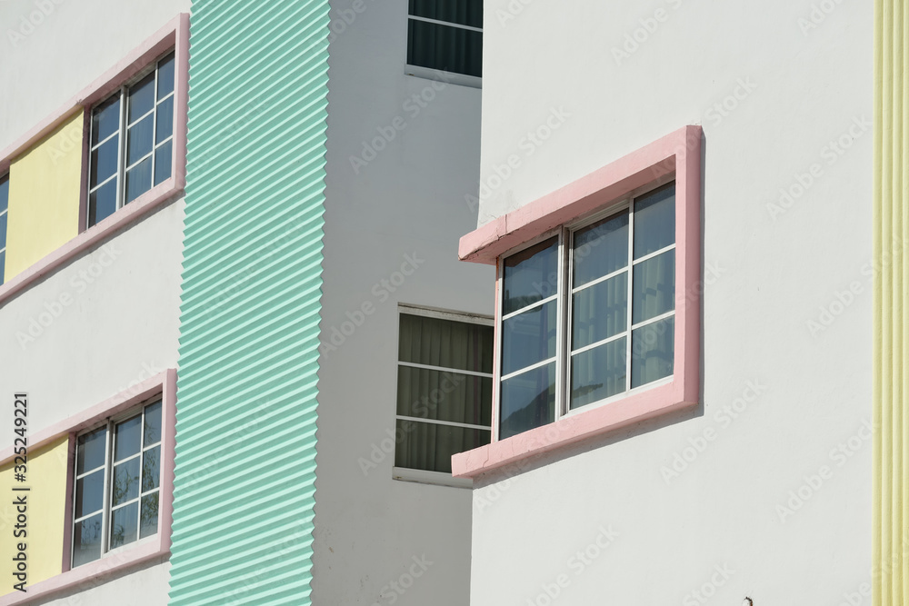 South Beach buildings facades, architectural detail. Pastel colors, geometric patterns and corrugated texture wall.