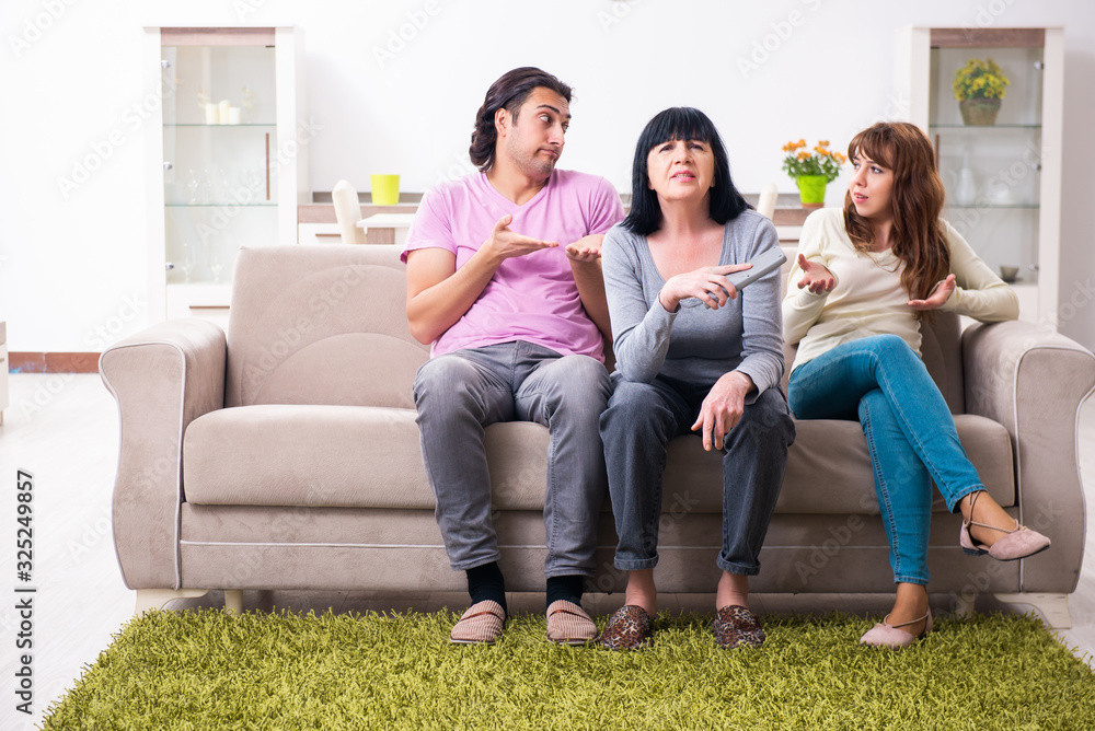 Young family and mother-in-law in family issues concept Young family and mother-in-law in family issues concept