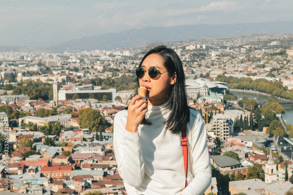 Φωτογραφία Asian woman tourist is taking selfie of herself with landscape view of Tbilisi, Georgia