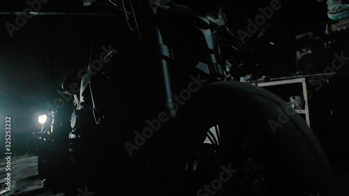 black motorcycle silhouette in garage ghostbike 2 photo