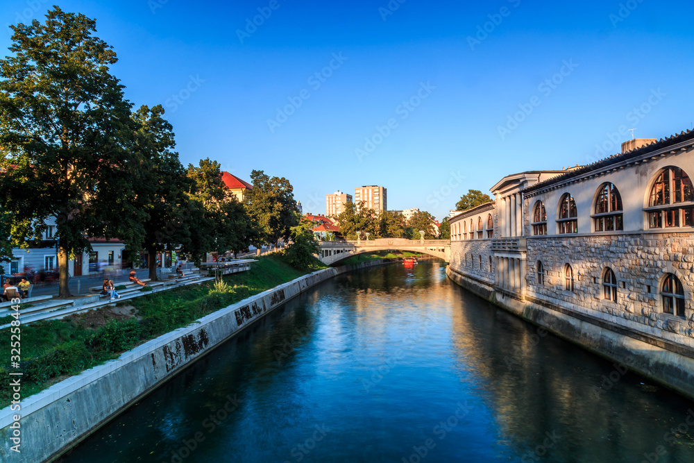 Cityscape on Ljubljanica River with sunlight