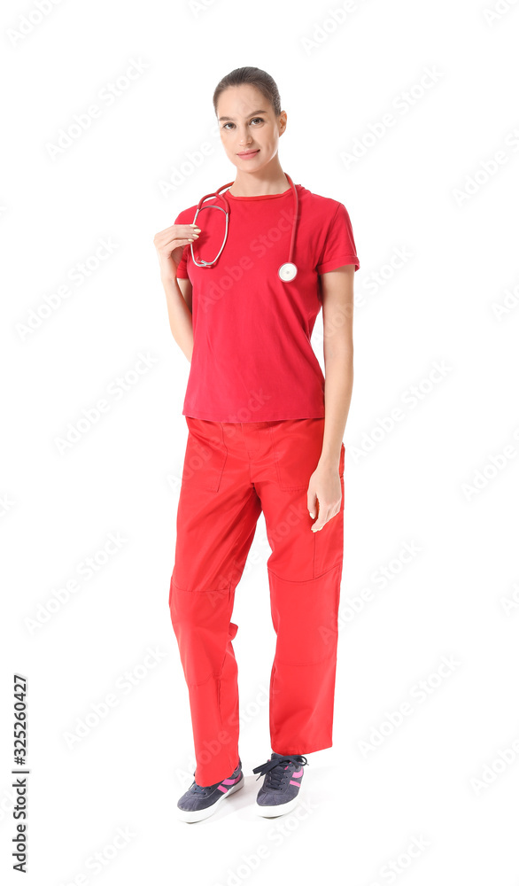 Fototapeta premium Female paramedic on white background