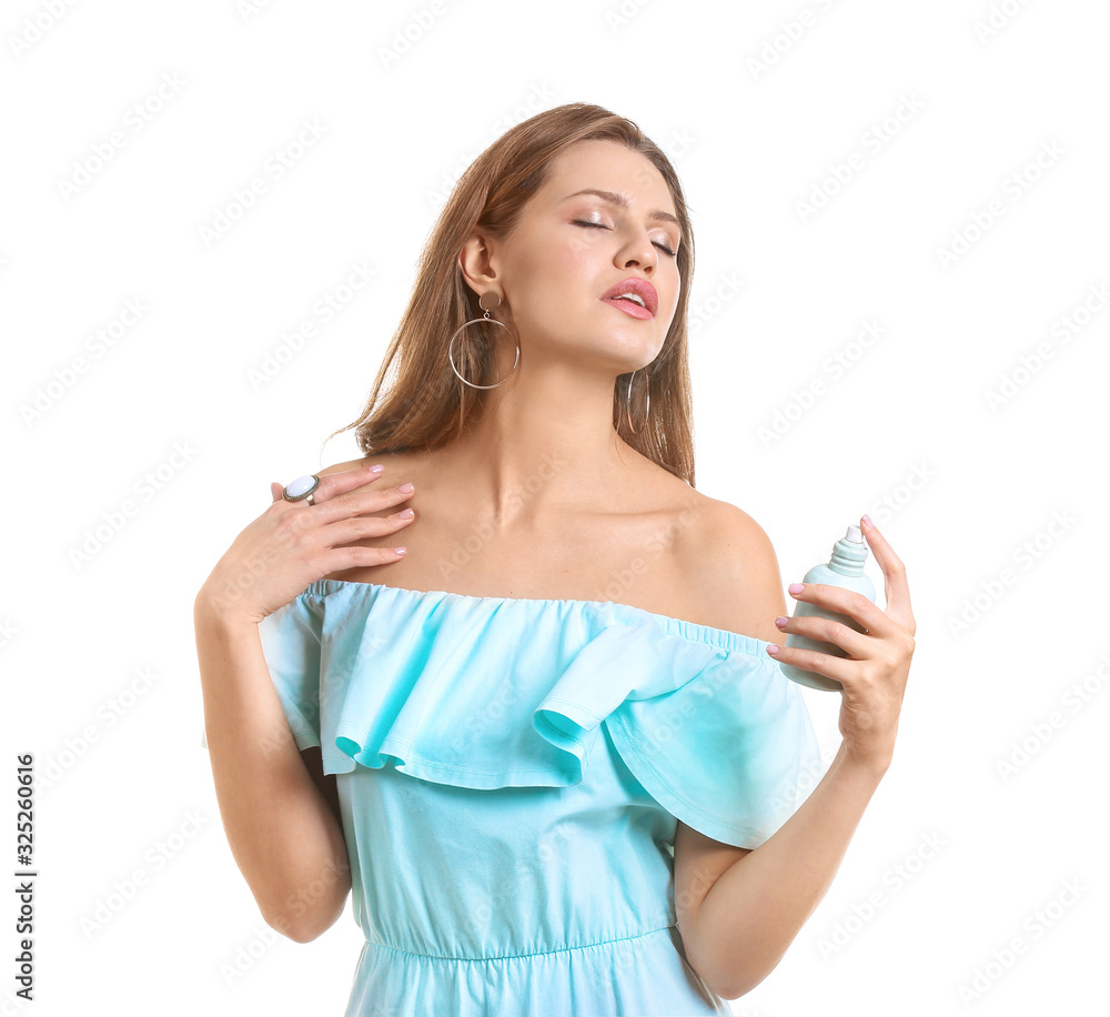 Beautiful young woman with bottle of perfume on white background Beautiful young woman with bottle of perfume on white background
