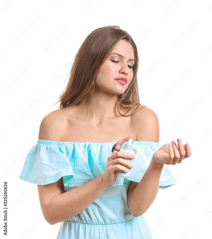 Beautiful young woman with bottle of perfume on white background Beautiful young woman with bottle of perfume on white background