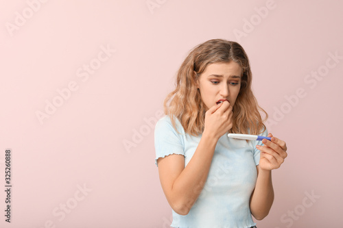 Sad young woman with pregna...