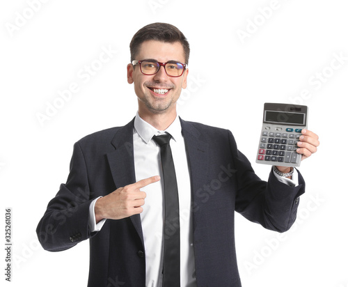 Happy male bank manager with calculator on white background