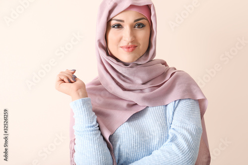 Beautiful Arab woman on color background © Pixel-Shot