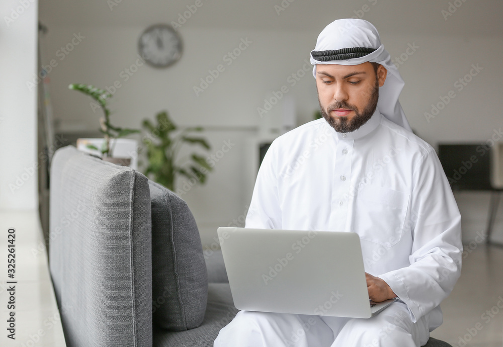 Arab businessman with laptop in office Arab businessman with laptop in office