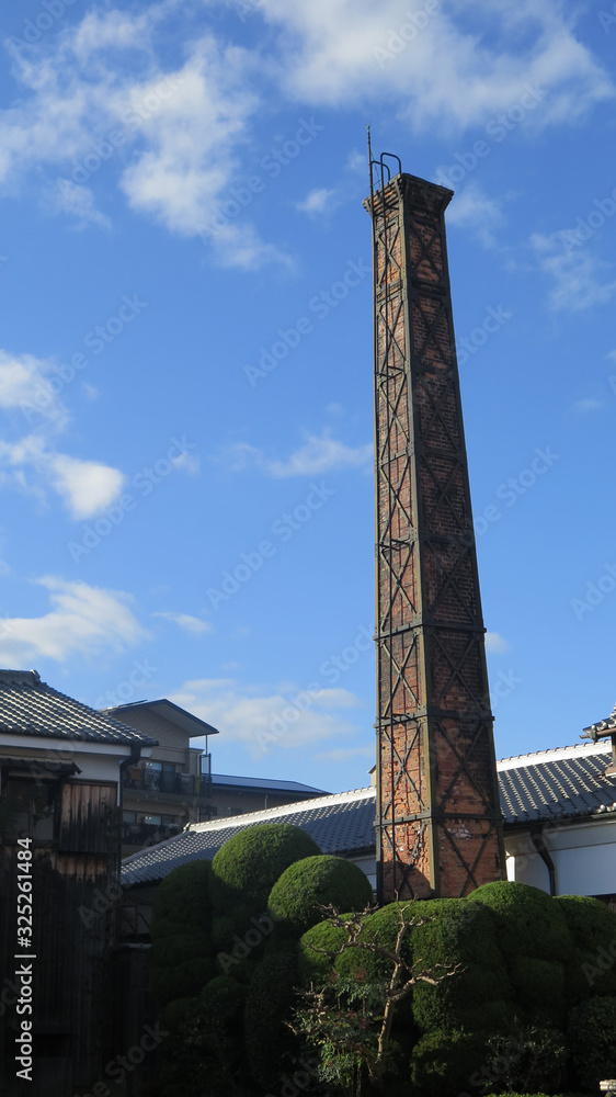 Tall square brick chimney at Kyoto sake brewery