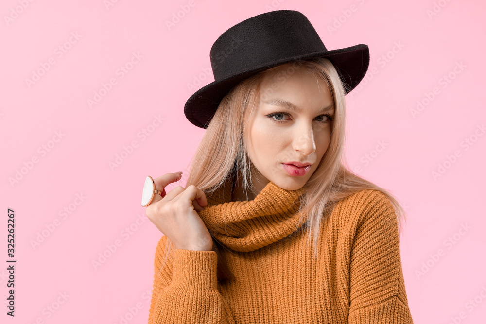 Young woman in warm sweater on color background Young woman in warm sweater on color background