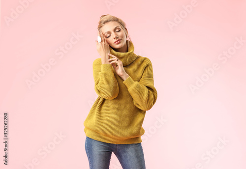 Young woman in warm sweater...
