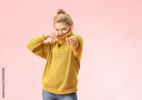 Young woman in warm sweater...