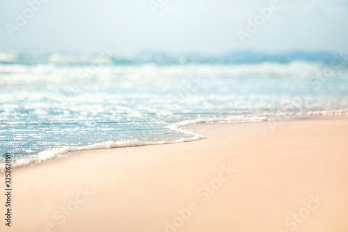 Fototapeta Close-up soft wave of the sea on the sandy beach