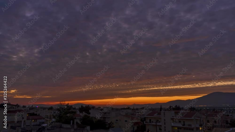 Time lapse of sunset on a cloudy day with beatiful orange clolours taken from Adames settlement , Kifissia, Athens, Greece Time lapse of sunset on a cloudy day with beatiful orange clolours taken from Adames settlement , Kifissia, Athens, Greece