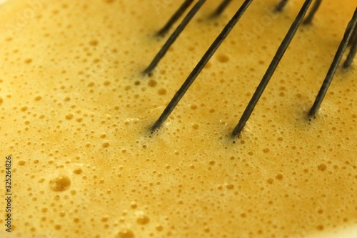 whisk in the dough with bubbles. Sweet pastry. Homemade cooking. Prepare food. Sweet dessert. Delicious homemade food. Cooking ingredient