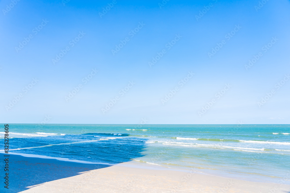 Beautiful tropical beach sea ocean with white cloud and blue sky