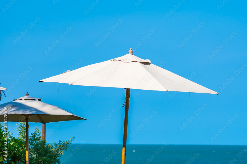 Umbrella and chair around beach sea ocean