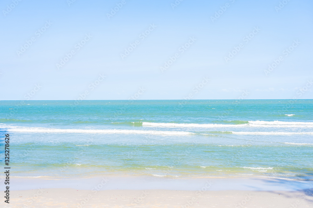 Beautiful tropical beach sea ocean with white cloud and blue sky Beautiful tropical beach sea ocean with white cloud and blue sky