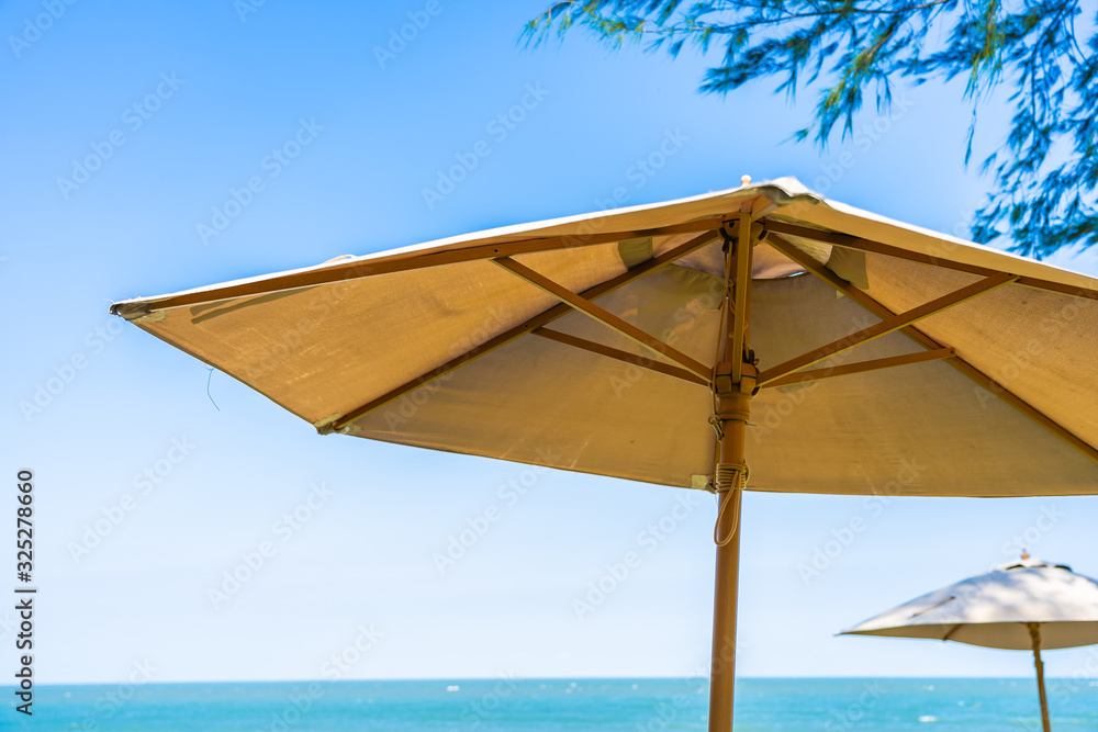 Umbrella and chair around beach sea ocean