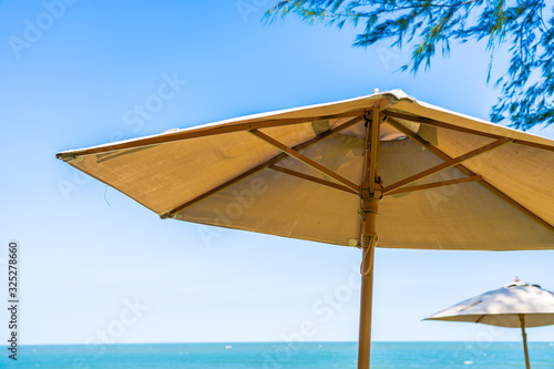 Fototapeta Naklejka Na Ścianę i Meble -  Umbrella and chair around beach sea ocean