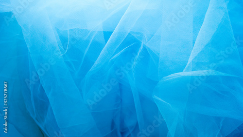 Cuadro en lienzo A blue tulle fabric is used as a background with copy space