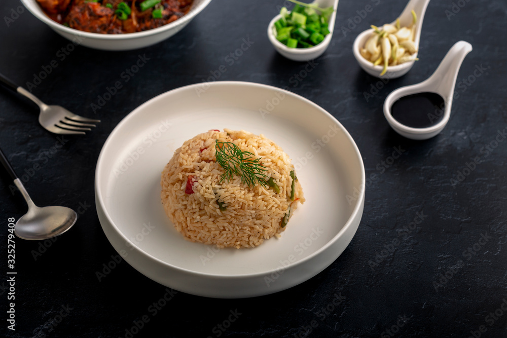Vegetarian fried rice with manchurian served in a plate Vegetarian fried rice with manchurian served in a plate