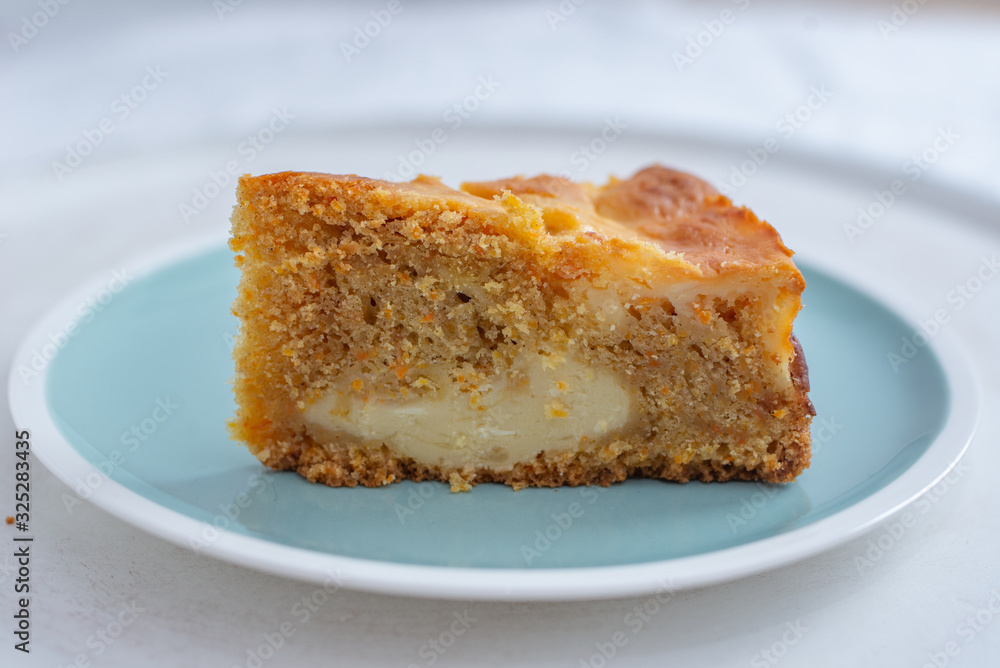 home made carrot cake cheesecake on a table home made carrot cake cheesecake on a table