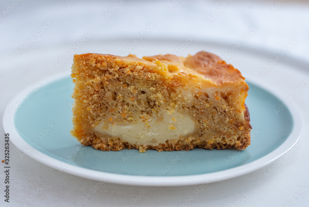 home made carrot cake cheesecake on a table