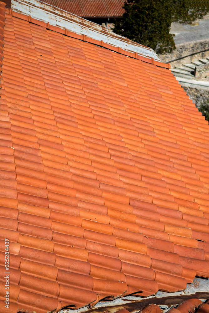 Fototapeta premium Tiled roof. Mediterranean architecture abstract background texture.