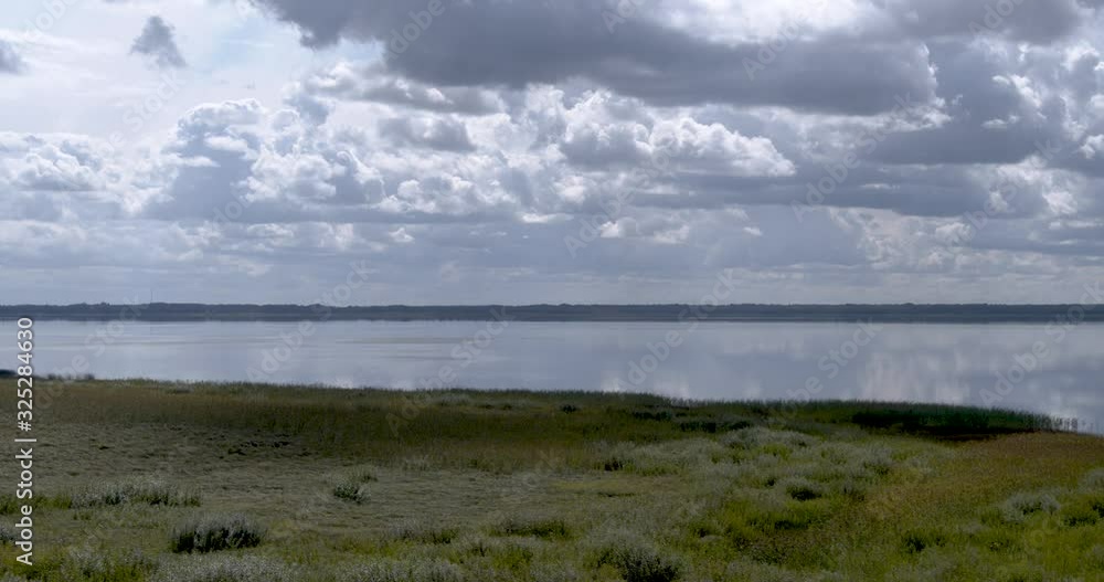 Summer clouds over lake time lapse Summer clouds over lake time lapse