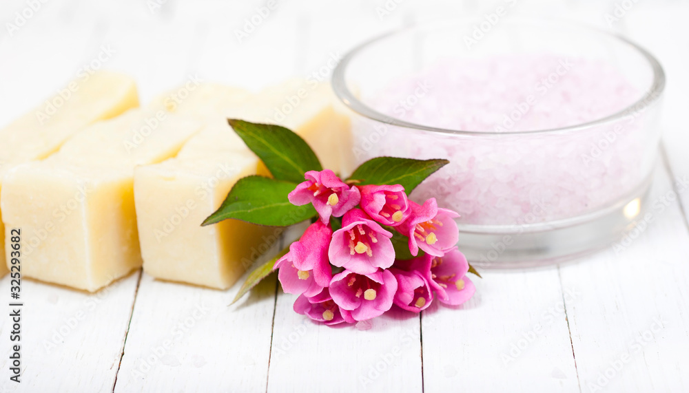 soaps, bath salts on white wood table soaps, bath salts on white wood table