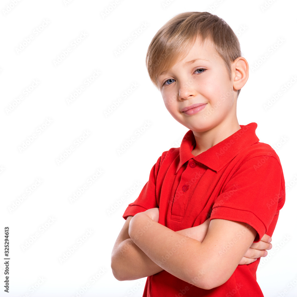 Photo of adorable young boy looking at camera. Cute blond boy with a crossed arms posing at studio. Portrait of white kid in a red t-shirt. Pretty kid with a easy smile. Photo of adorable young boy looking at camera. Cute blond boy with a crossed arms posing at studio. Portrait of white kid in a red t-shirt. Pretty kid with a easy smile.