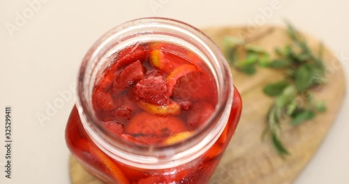 Wallpaper Mural Putting strawberry and lemon marmalade into glass jar Torontodigital.ca