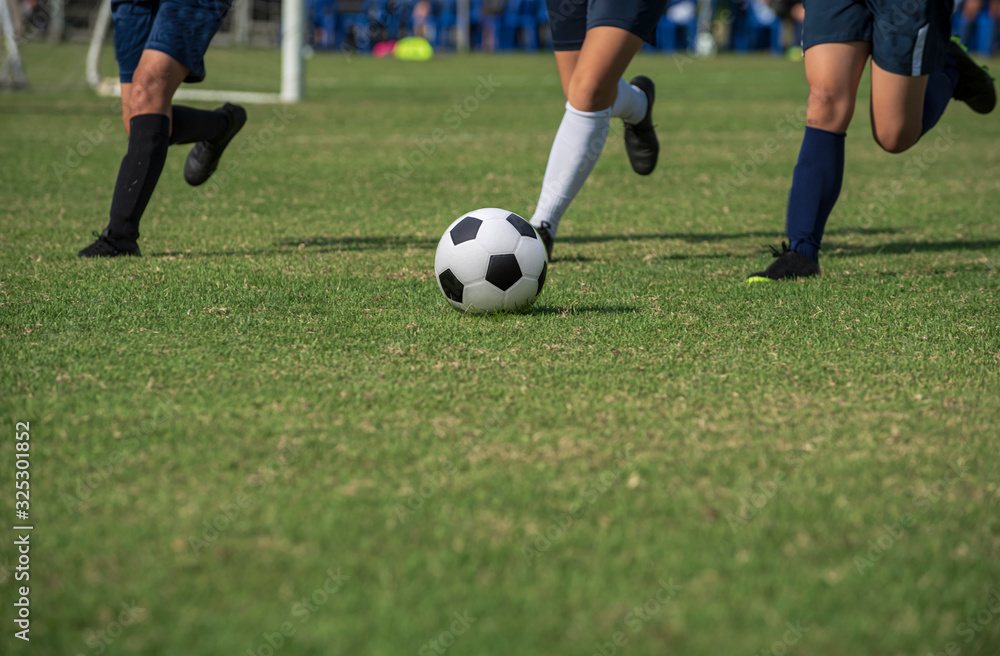 Football match in Girls' Under 15 years school soccer tournament. Players are in action of defending and attacking mode in the morning time.