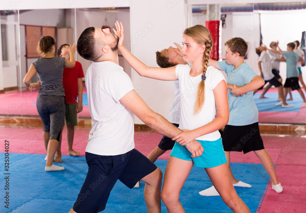 Kids exercising self-defense movements