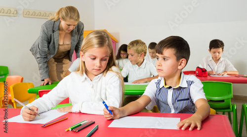 Children discussing during lesson