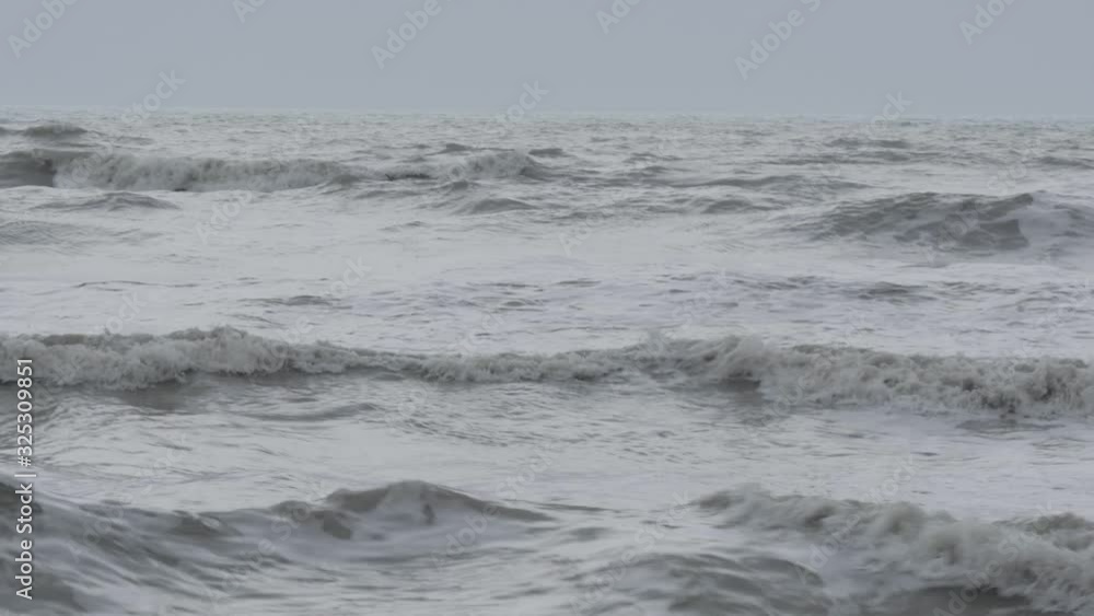 Man kayaking in a stormy sea. Man kayaking in a stormy sea.